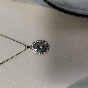 This gorgeous religious stainless steel necklace  blue and silver color